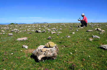 A naturalist looks for fossils in the Valderejo Natural Park. Alava. Basque Country. Spain