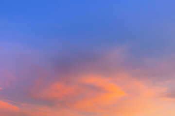 Clouds and sky in the evening,Sky blue and orange light of the sun through the clouds in the sky