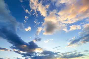 Clouds and sky in the evening,Sky blue and orange light of the sun through the clouds in the sky