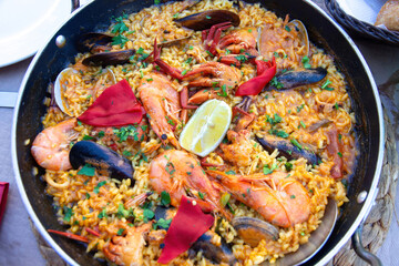 Seafood paella on the table ready to be tasted 