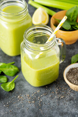 Clean eating. Detox smoothie. Green healthy drink with spinach,banana, cucumbers, lime and mint.