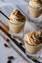 White Russian. Dessert Cocktail. Alcoholic Drinks made with gin, vodka, rum or whiskey mixed with soda water, fruit juices and garnishes with limes and cherries. Classic American bar drinks.