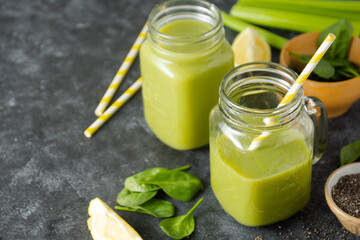 Clean eating. Detox smoothie. Green healthy drink with spinach,banana, cucumbers, lime and mint.