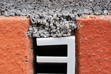 ventilation plastic insert in a brick wall