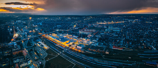 Brest, Belarus. Aerial Bird's-eye View Of Cityscape Skyline. Night Aerial View Of Railway Station. Panorama, Panoramic View - obrazy, fototapety, plakaty