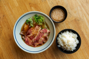 shabu set with boiled pork and condotion with rice on hot soup