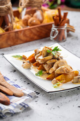 Cooked chicken breast with potatoes and rosemary