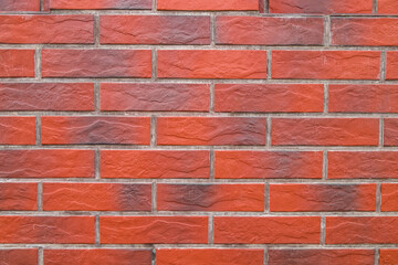 The wall is decorated with artificial stone as a background.