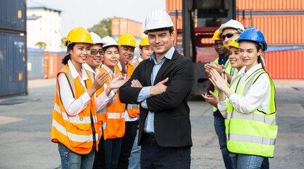 Group of construction worker or engineer applauding to manager for success work. Logistics teamwork...