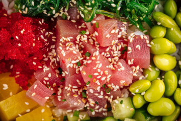 Closeup on hawaiian tuna poke bowl with vegetables