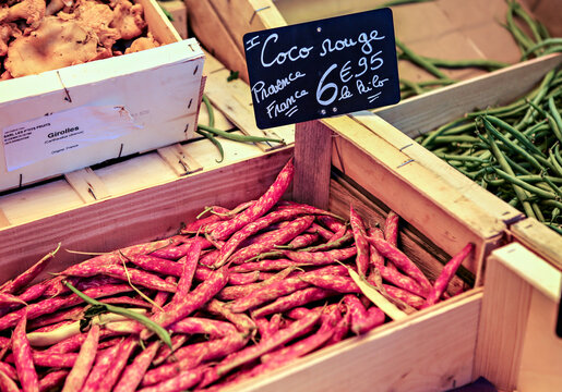 Coco Rouge or red beans in a wooden box for sale at the market in Provence.