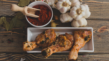 Seasoned chicken drumsticks prepared for baking in the oven