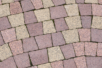 Stone block pavement. Brown paving slabs, close up. Pattern of paving blocks, top view