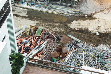 Construction yard with cluttered debris and scattered materials.  Dirty grungey mess.  Graphical...
