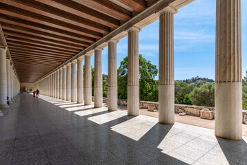 Athens, Attica, Greece. Interior view of the colonnade  of the Stoa of Attalus at the archaeological site of the Agora of Athens in Thiseio district under the Acropolis. Perspective