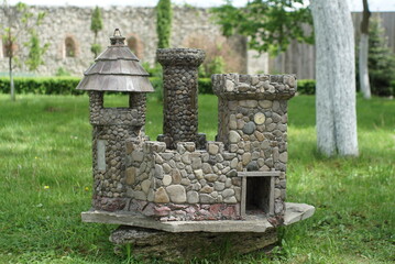 Fototapeta premium small lock made of pebbles by hand 