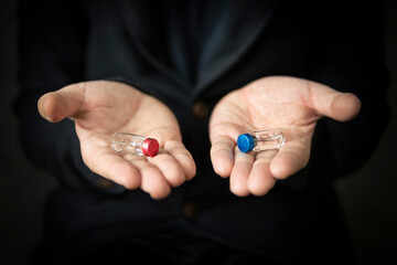 red ampoule and blue ampoule. The right choice concept of the movie matrix. choosing the best...