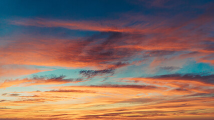 Fototapeta na wymiar isolated shot of vibrant colored sky with clouds at sunset