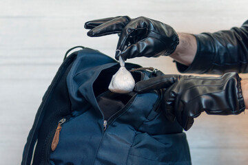 police officer searches a drug dealer. I put the drugs in pocket. Committing a crime. Illegal drug...