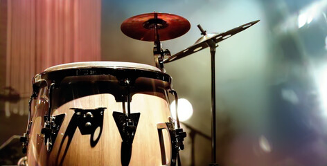 Fototapeta na wymiar Conga drum instrument with colored background