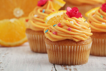 Cupcakes with orange icing on top