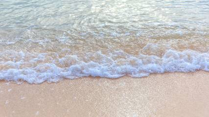 Fototapeta na wymiar Sea wave or water foam at sand beach of island.