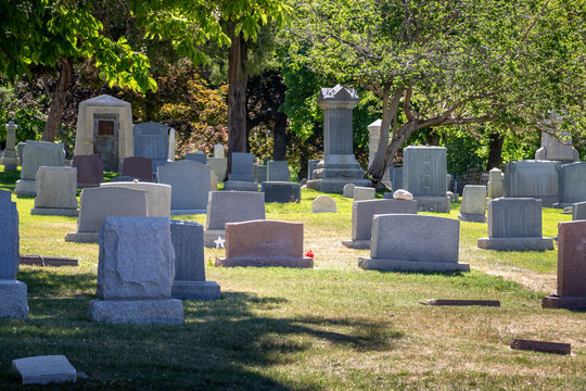 A Variety of Different Style Headstones and Gravestones at a Cemetery
