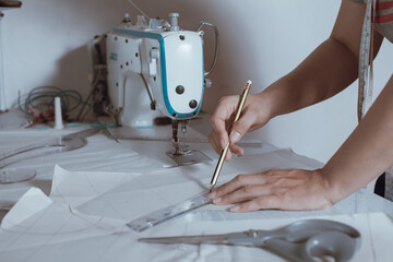 tailor made pattern Design clothes with pencils, rulers and scissors. Top view
