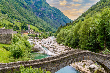 View of Bridge Ponte dei Salti to Verzasca River at Lavertezzo - clear and turquoise water stream and rocks in Ticino - Valle Verzasca - Valley in Tessin - Travel destination in Switzerland - 436909637