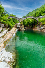 View of Bridge Ponte dei Salti to Verzasca River at Lavertezzo - clear and turquoise water stream...
