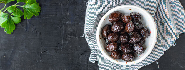 olives dried sun-dried tasty olive dry fruit appetizer salad addition on the table healthy food meal snack copy space food background rustic 