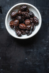 olives dried sun-dried tasty olive dry fruit appetizer salad addition on the table healthy food meal snack copy space food background rustic 
