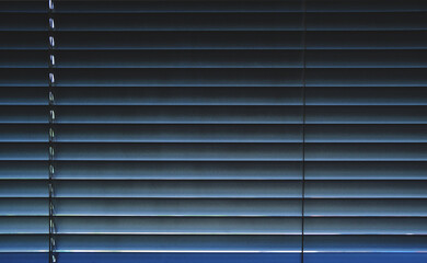 Obraz premium Striped Background Closed Metal Blinds on Window