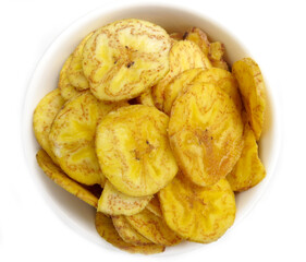 Golden plantain chips in a white bowl