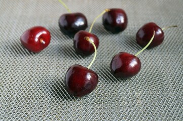 Ripe cherries berries on a gray background. Close-up 
