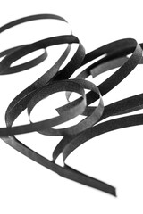 A curled black paper ribbons. Abstract artistic patterns. Design concept. Ready solutions for interior design office. Macro lens close up shot 1:1. Monochrome image.