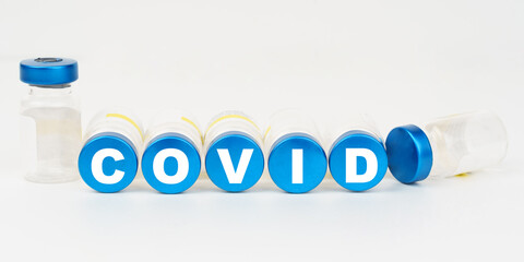 On the blue roofs of the injections it says - COVID