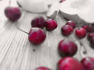 Naklejka na ściany i meble cherries on a wooden table