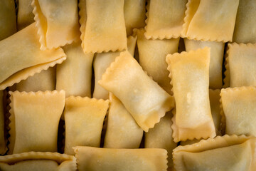 Texture classic agnolotti ravioli with filling. Fresh Italian Pasta Ravioli close-up