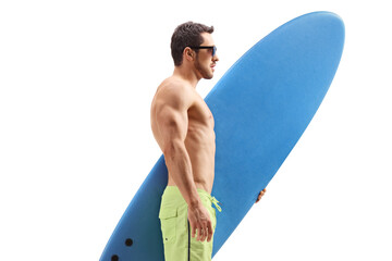 Fit man with a surfboard standing and waiting