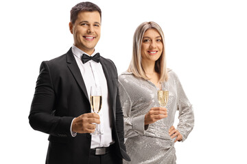 Young man and woman in elegant clothes holding glasses of sparkling wine
