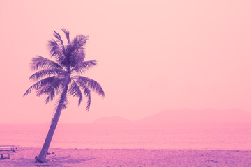 Tropical coconut tree against the background of the sea, bright purple and pink tint. Travel and tourism. Postcard, template for text