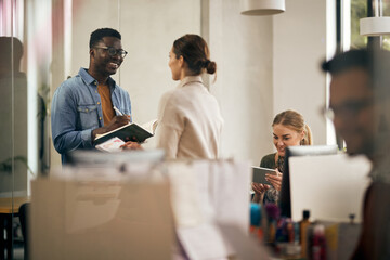 Group of young entrepreneurs working together at casual office.