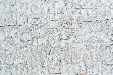 Wood texture background with white peeling paint for text or design.