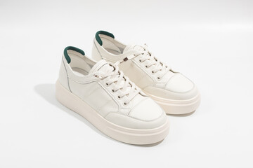 Women's white leather sneakers with thick soles