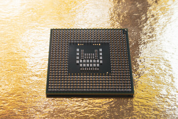 Processor on a gold background. Soft focus