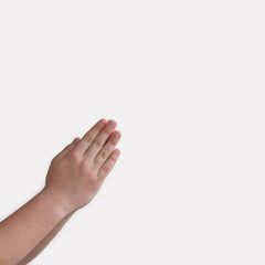 boy's hands folded for prayer