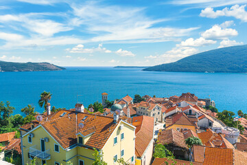Summer view on houses with red roof and Bay of Kotor (Herceg Novi, Montenegro)