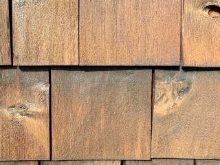 Closeup, vintage style exterior wall showing wood plank texture.
