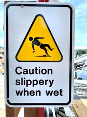 Warning sign “Caution slippery when wet”